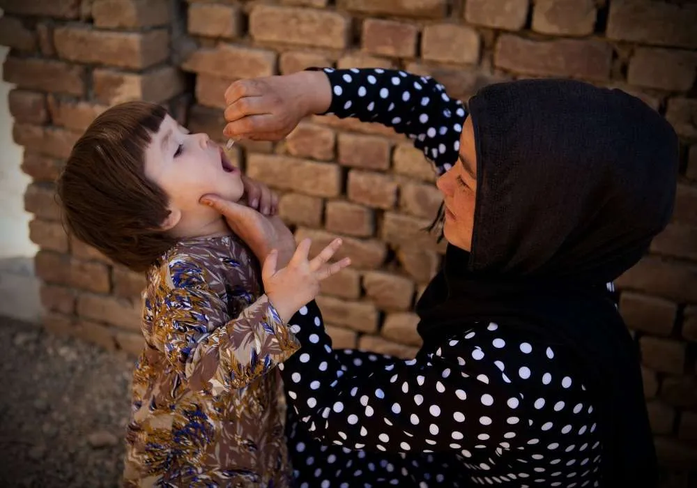 A female health worker monitors the polio vaccination campaign coverage